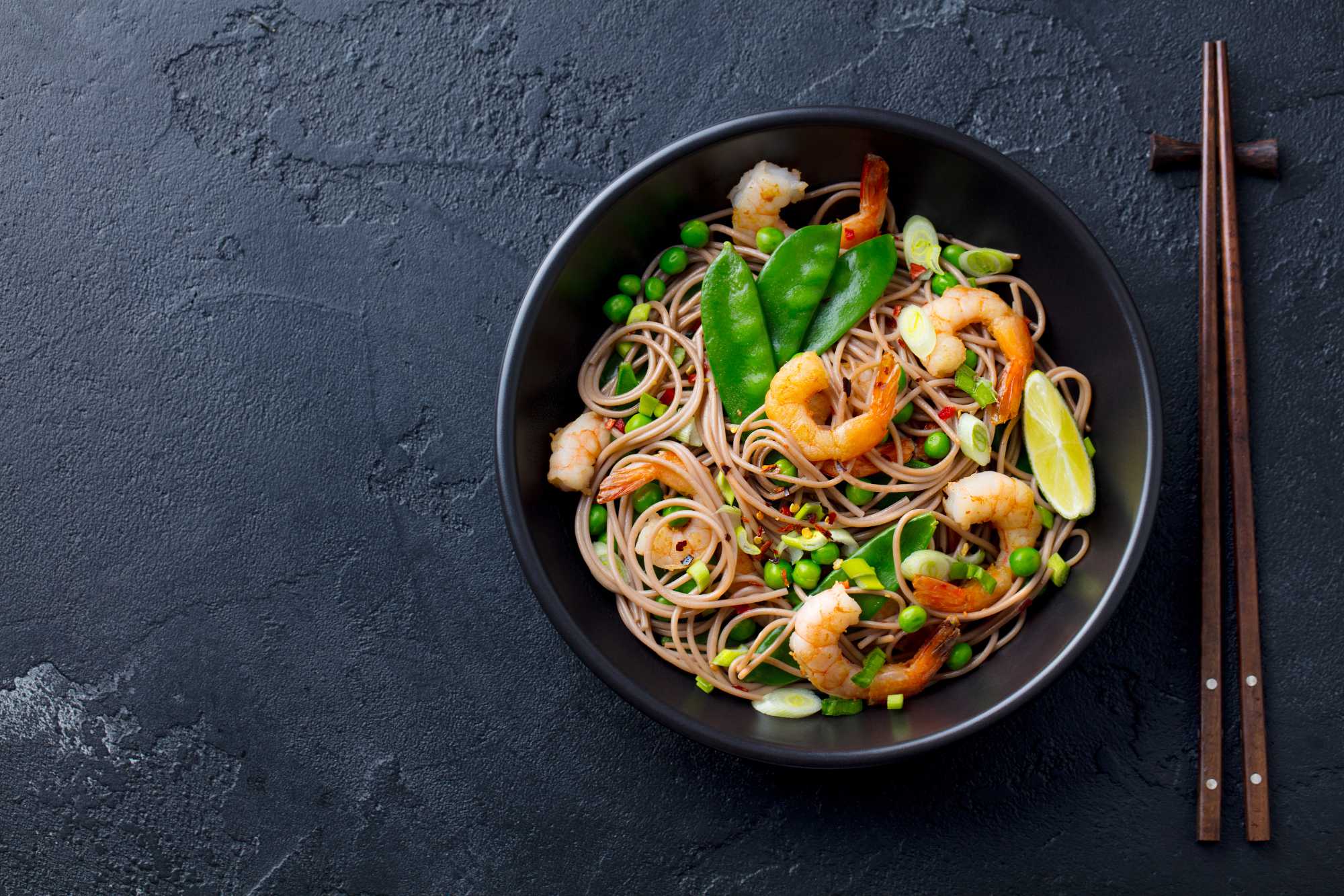 stir-fry-noodles-with-vegetables-and-shrimps-in-bl-SMA38T2.jpg
